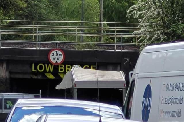 The van stuck beneath the low bridge on Prescott Street