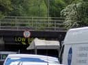 The van stuck beneath the low bridge on Prescott Street