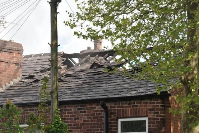 Damage to the roof of the house on Vine Street, Whelley