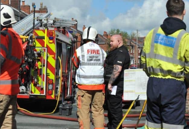 Fire and police at the scene of the fire at a house on Vine Street, Whelley,