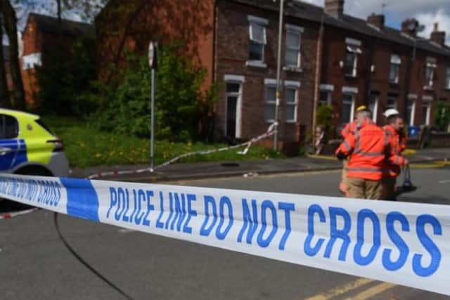 Police tape in place in Vine Street, Whelley