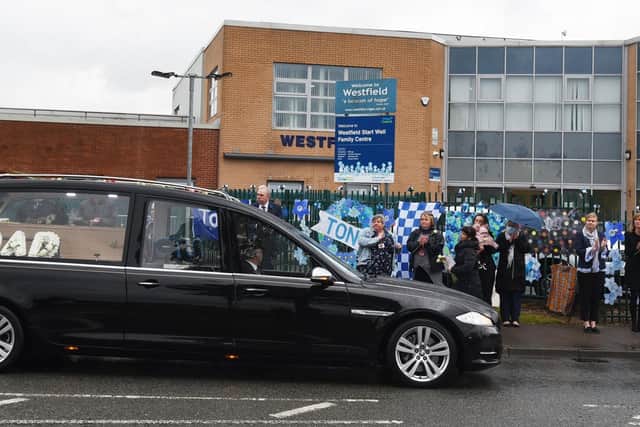 The hearse going past Westfield Community School on Montrose Avenue