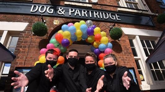 Staff prepare to welcome back customers to the Dog and Partridge in Wigan