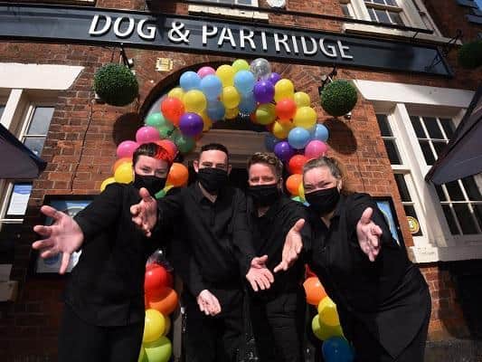 Staff prepare to welcome back customers to the Dog and Partridge in Wigan