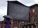 A public health digital board advises the public to follow the rules as a Covid-19 variant of concern is affecting the community in Bolton