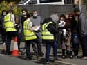 People queuing for Covid vaccinations at the ESSA academy in Bolton as the spread of the Indian coronavirus variant could lead to the return of local lockdowns