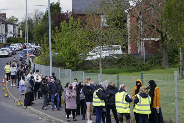 People queuing for Covid vaccinations at the ESSA academy in Bolton as the spread of the Indian coronavirus variant could lead to the return of local lockdowns