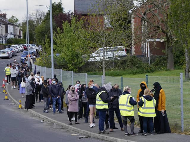 People queuing for Covid vaccinations at the ESSA academy in Bolton as the spread of the Indian coronavirus variant could lead to the return of local lockdowns
