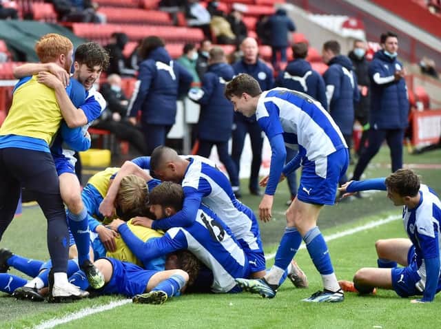 The Latics starlets celebrate the match-clinching second goal at Charlton