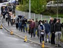 A queue of people waiting to get the coronavirus vaccination in Bolton