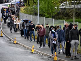 A queue of people waiting to get the coronavirus vaccination in Bolton