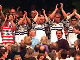 The Wigan team who had already changed shirsts with the Bath  players applaud  the fans