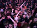 Concert-goers enjoy a non-socially distanced outdoor live music event at Sefton Park on May 2, 2021 in Liverpool.