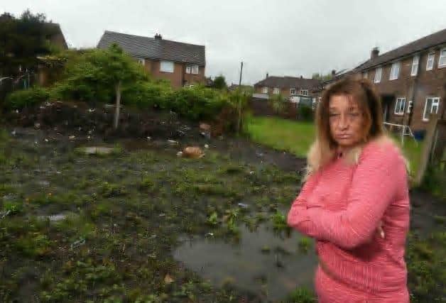 Debbie Caveney has complained to the council about her back garden which floods and is in a state