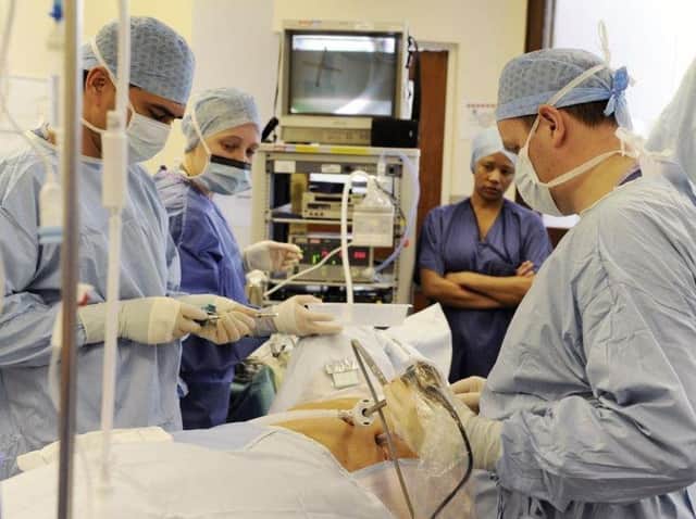 Specialist surgical hubs need to be established in England to tackle a “colossal backlog” of non-urgent procedures, the Royal College of Surgeons (RCS) said