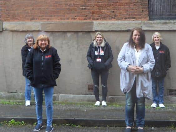The Brick CEO Louise Green and food bank volunteers
