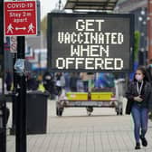 People shop and go about their daily life in Bolton town centre as surge testing and rapid coronavirus vaccinations continue.