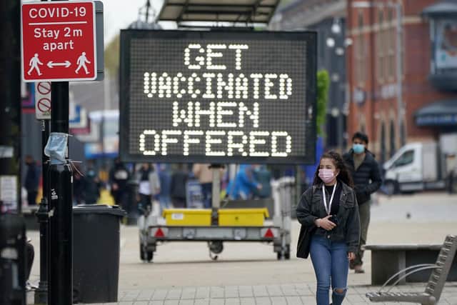People shop and go about their daily life in Bolton town centre as surge testing and rapid coronavirus vaccinations continue.