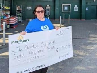 Samantha Dickinson with the £8,000 for The Christie