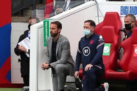 England's manager Gareth Southgate (L) and Steve Holland, Assistant Coach of England (R) 'take a knee' ahead of the international friendly football match between England and Romania at the Riverside Stadium in Middlesbrough.
