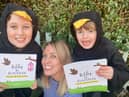 Jennifer Doyle with daughter Isabella and son Harry, holding up the Billy the Blackbird book