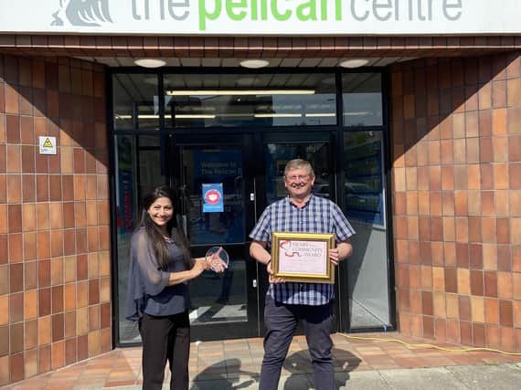 Coun Nazia Rehman presents the Heart of the Community award to Paul Costello