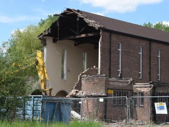 Bulldozers move in to the Our Lady of the Rosary RC Church on Plank Lane, Leigh