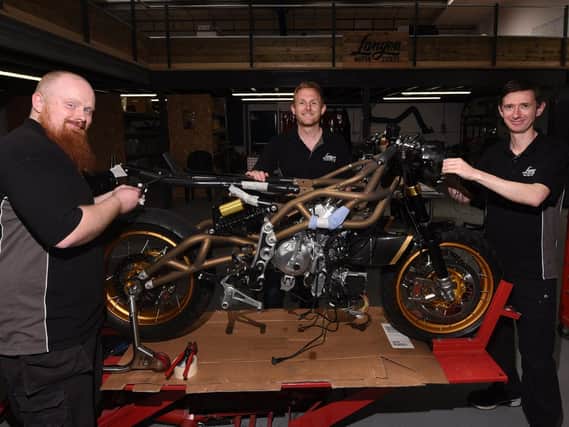 from left, Dan Ball, owner Christofer Ratcliffe and Andrew Naylor at Langen Motorcycles, bespoke motorbike factory