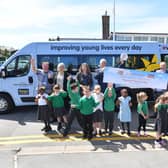 The Variety Sunshine minibus being presented to staff and pupils at Rowan Tree Primary school in Atherton