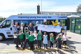 The Variety Sunshine minibus being presented to staff and pupils at Rowan Tree Primary school in Atherton