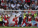 Christian Eriksen is helped from the pitch