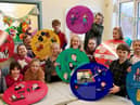 Pupils from Sacred Heart Catholic Primary School with some of the plaques