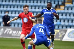 George Johnston in action for Latics