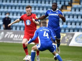 George Johnston in action for Latics