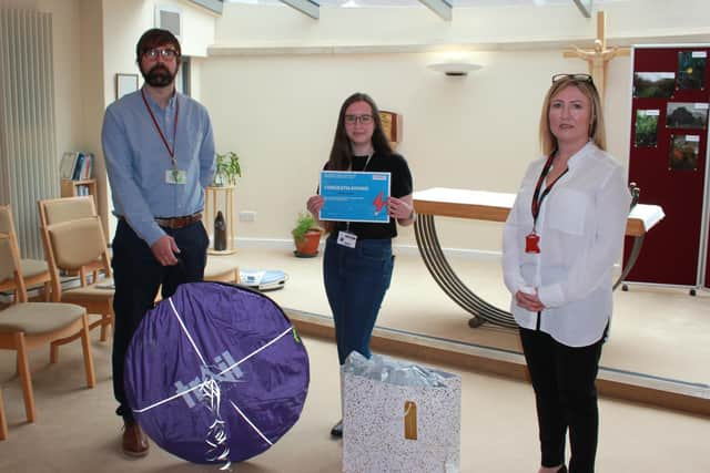 Elisha Foster with Chris Chandler, head of English at St John Rigby College, and Keely Dalfen