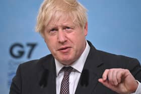 British Prime Minister Boris Johnson takes part in a press conference on the final day of the G7 summit in Carbis Bay on June 13, 2021 in Cornwall.