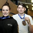 Emily Borthwick and Harry Coppell with medals from a previous competition