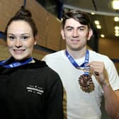 Emily Borthwick and Harry Coppell with medals from a previous competition