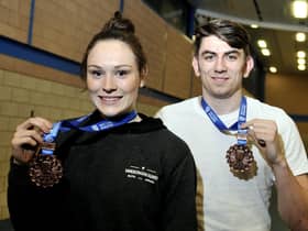 Emily Borthwick and Harry Coppell with medals from a previous competition