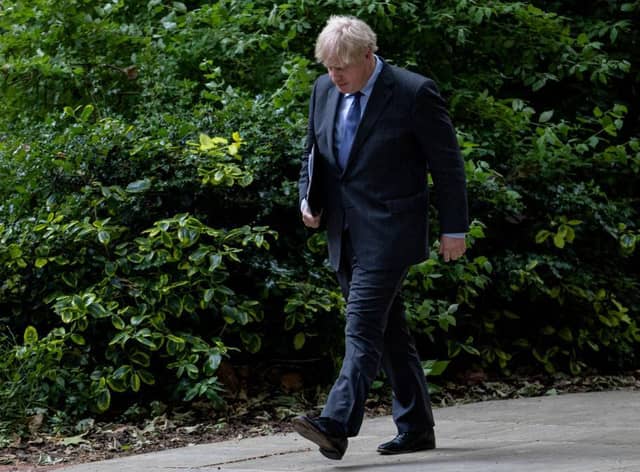 Boris Johnson returns to 10 Downing Street after giving a press conference on June 14