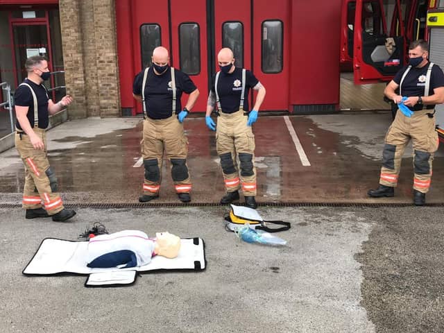 Firefighters refresh their CPR skills