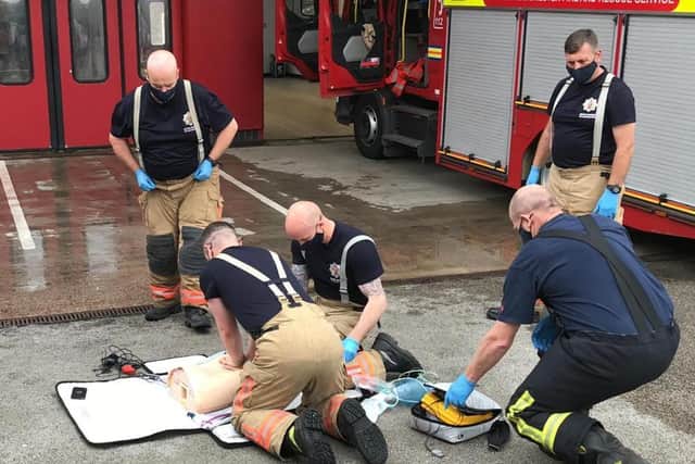 Firefighters refresh their CPR skills