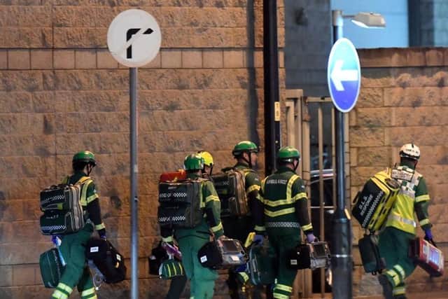 Medics deploy at the scene of a reported explosion during a concert in Manchester, England on May 23, 2017