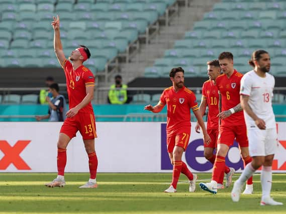 Kieffer Moore celebrates scoring against Switzerland