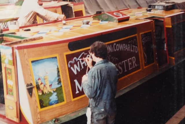 John working on a canal boat during his career as a signwriter