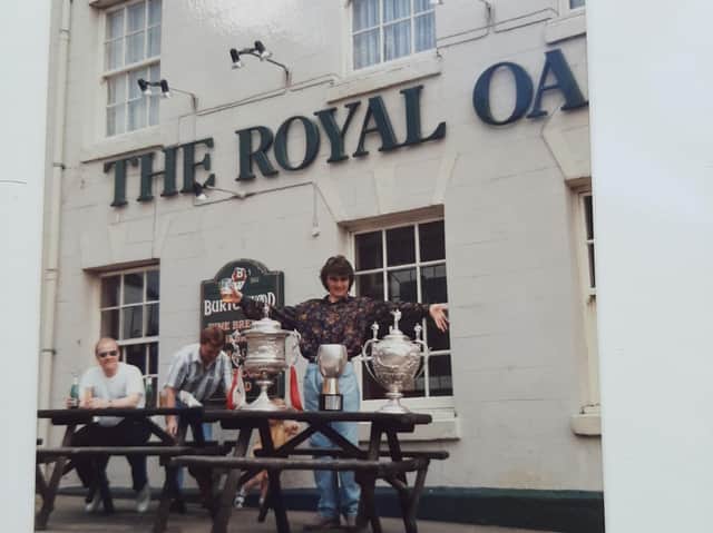David Greenwood with Wigan RL’s array of trophies outside The Royal Oak pub, Standishgate, more than 30 years ago
