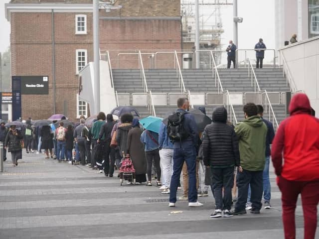 People queueing to get vaccinated