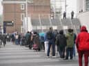 People queueing to get vaccinated