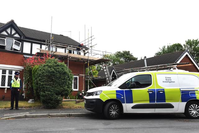 Police at the scene of the fatal fire in St James Grove, Poolstock