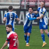 Zach Clough scores for Latics on the final day of the campaign against Swindon